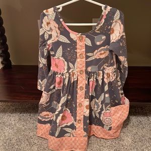 Brand: Cheeky Plum. Size:5T.  Floral dress with buttons and pockets.